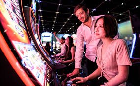 Live roulette table interface showing wheel, betting layout, and player chat